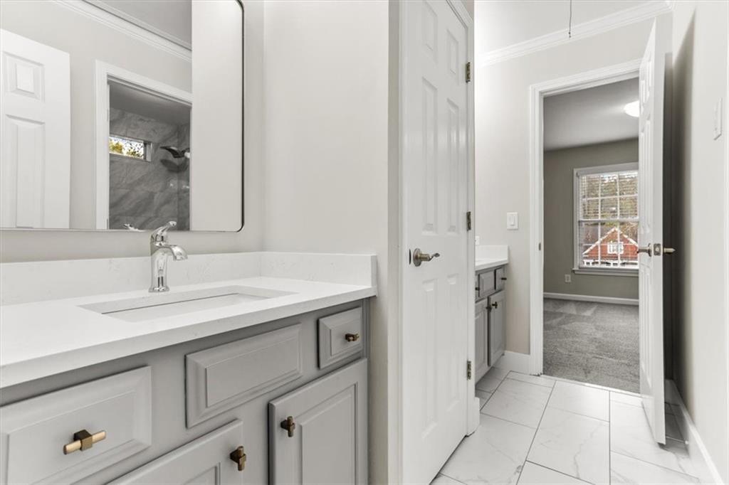 3425 Kingsland Circle Berkeley Lake, GA 30096 - Photo 32 of 45 a bathroom with a sink and a mirror