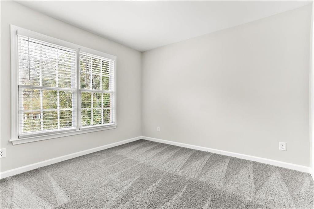 3425 Kingsland Circle Berkeley Lake, GA 30096 - Photo 34 of 45 an empty room with a window