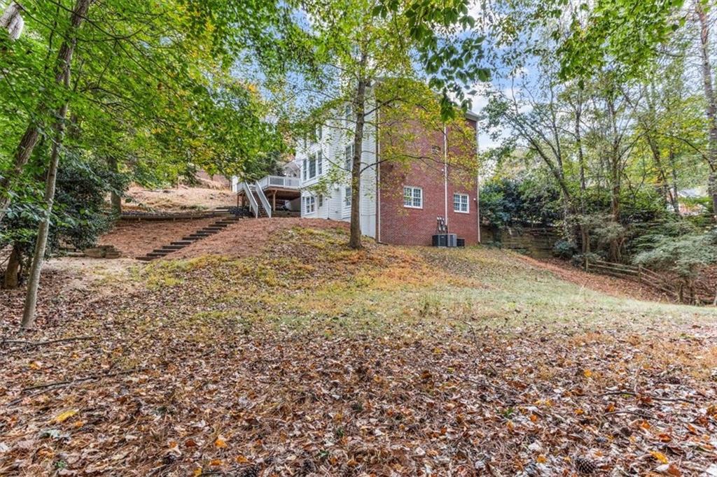 3425 Kingsland Circle Berkeley Lake, GA 30096 - Photo 44 of 45 a view of a house with large trees