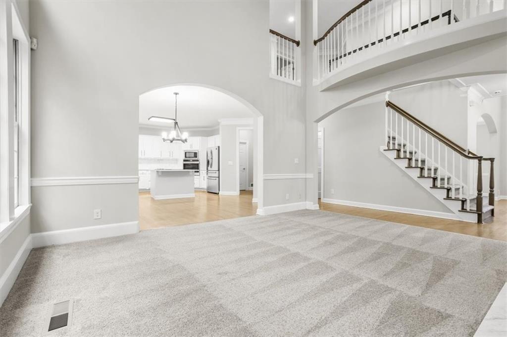 3425 Kingsland Circle Berkeley Lake, GA 30096 - Photo 8 of 45 a view of an entryway with wooden floor