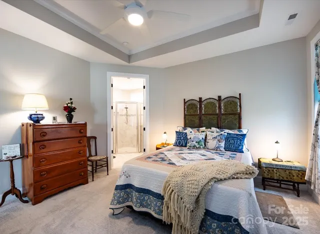 a bedroom with a bed and a mirror