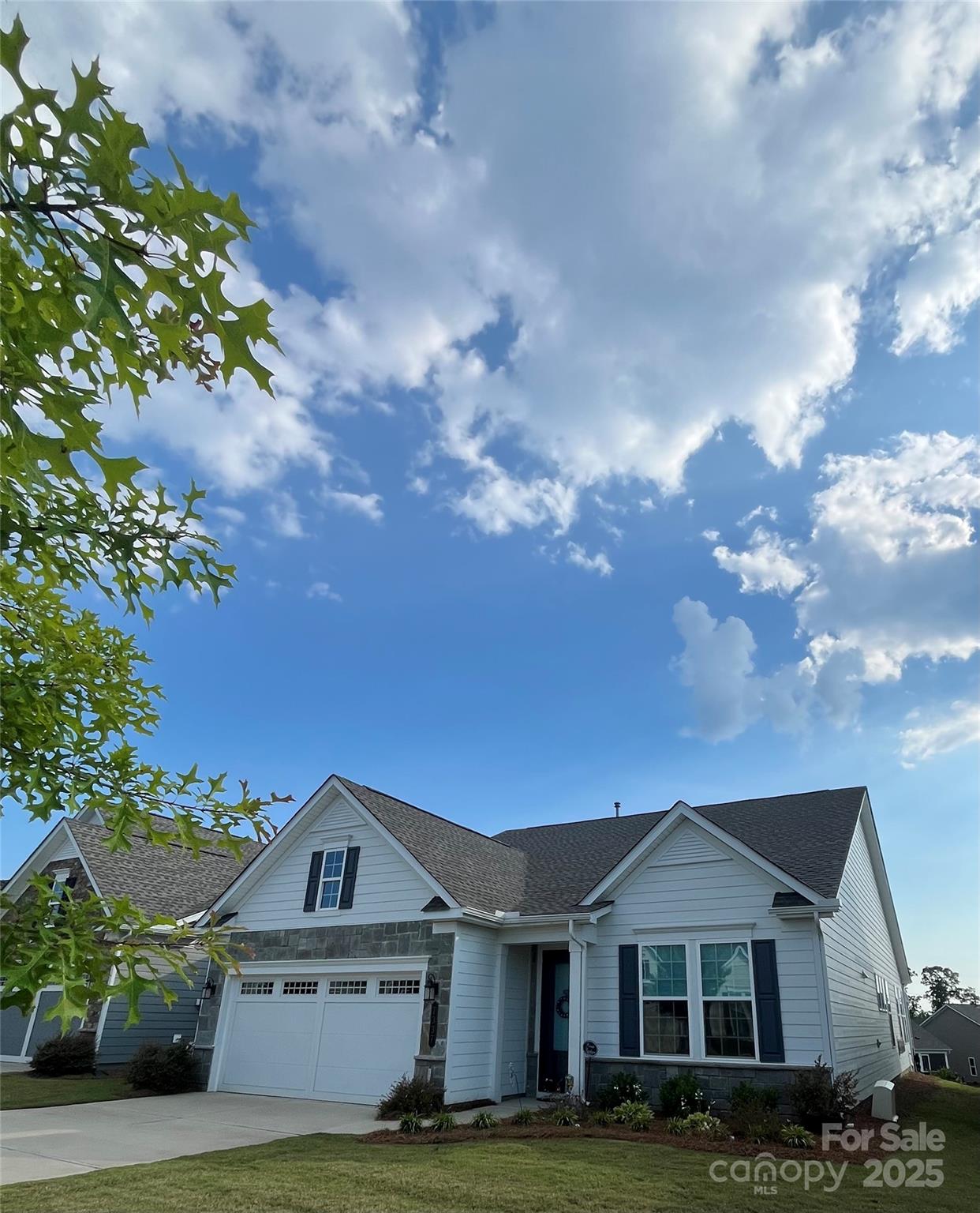 7337 Overjoyed Crossing Charlotte, NC 28215 - Photo 2 of 28 a front view of a house with a garden and yard