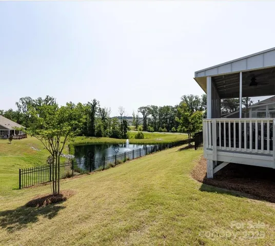 a view of a swimming pool with a lake view