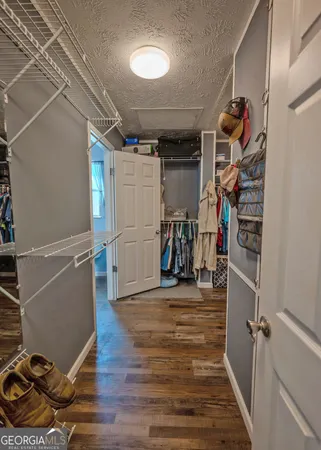 a view of a room with wooden floor