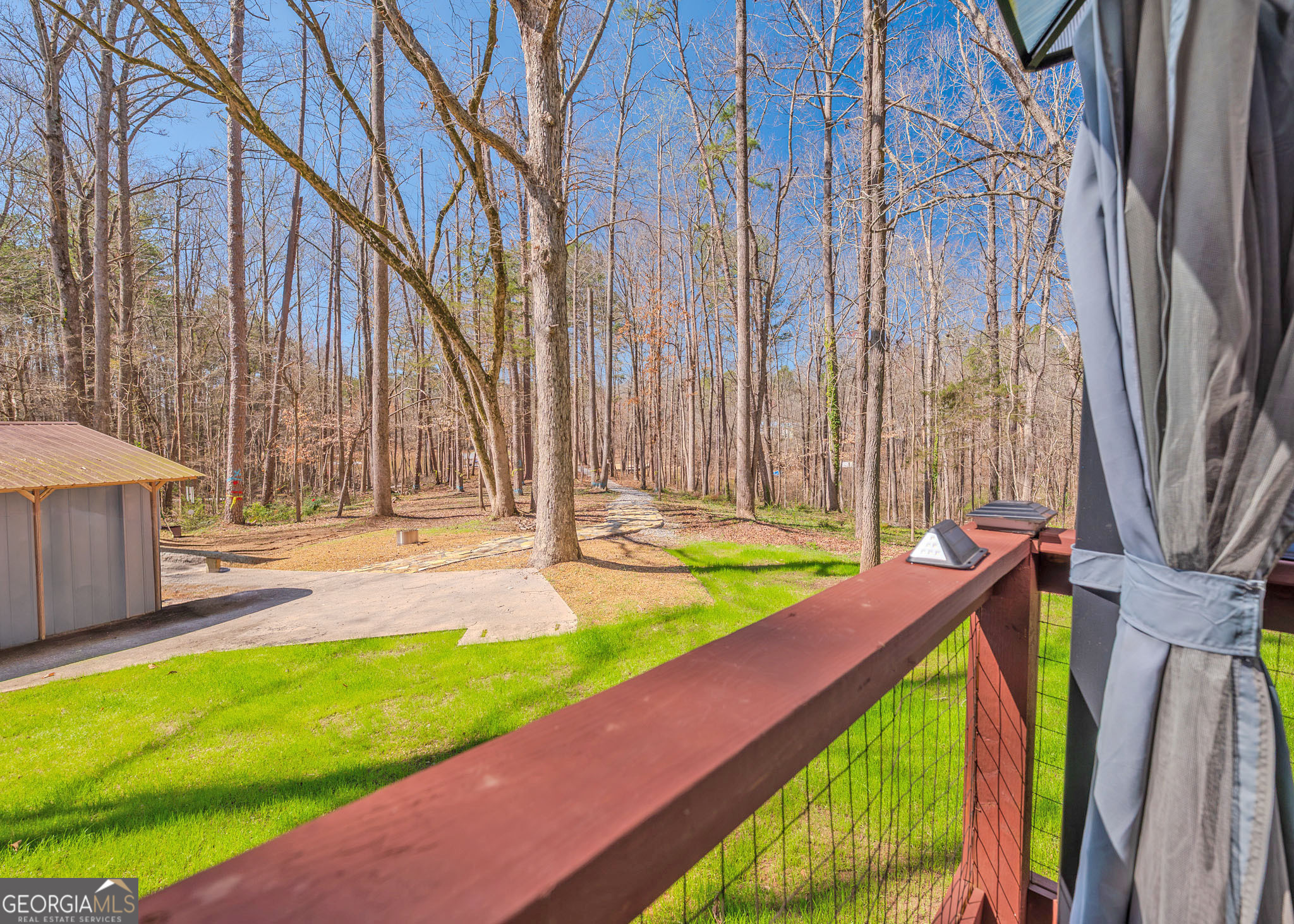 272 Lakeside Trail Martin, GA 30557 - Photo 27 of 35 a view of a backyard with a small pool and wooden chair