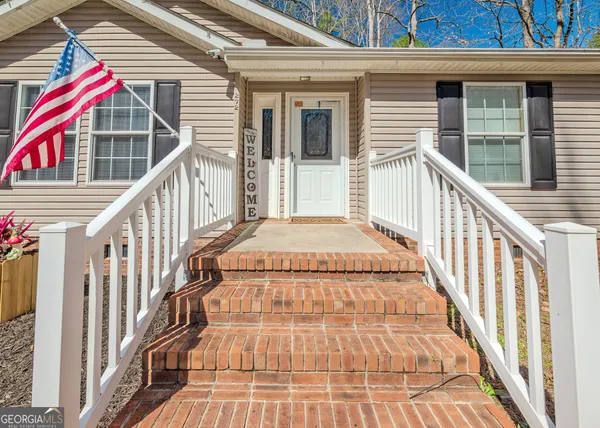 a view of balcony with wooden floor and fence