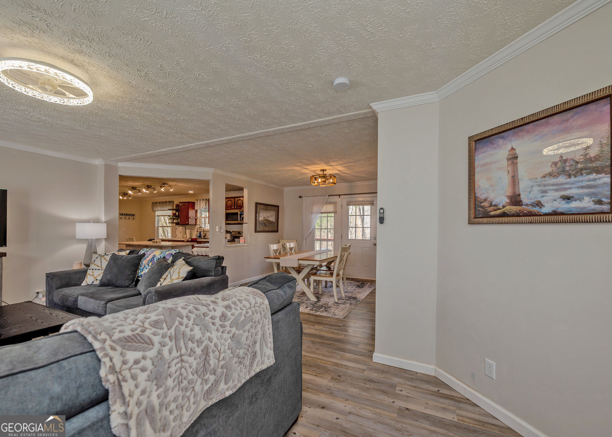 272 Lakeside Trail Martin, GA 30557 - Photo 7 of 35 a living room with furniture a large window and wooden floor