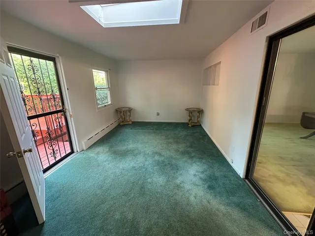 a view of an empty room with windows