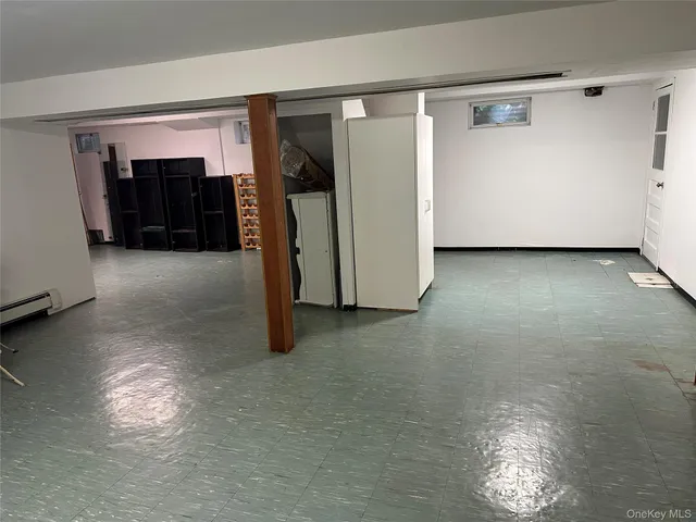 a view of a livingroom with furniture and closet area