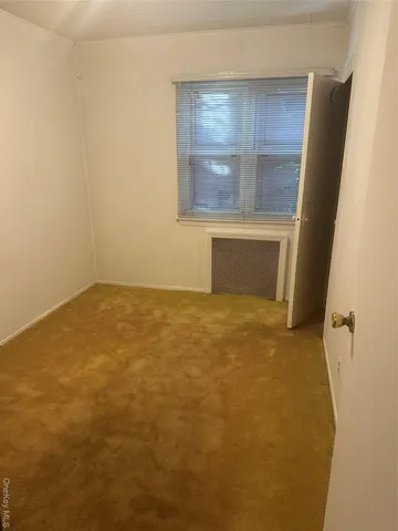 a view of a house with backyard and porch