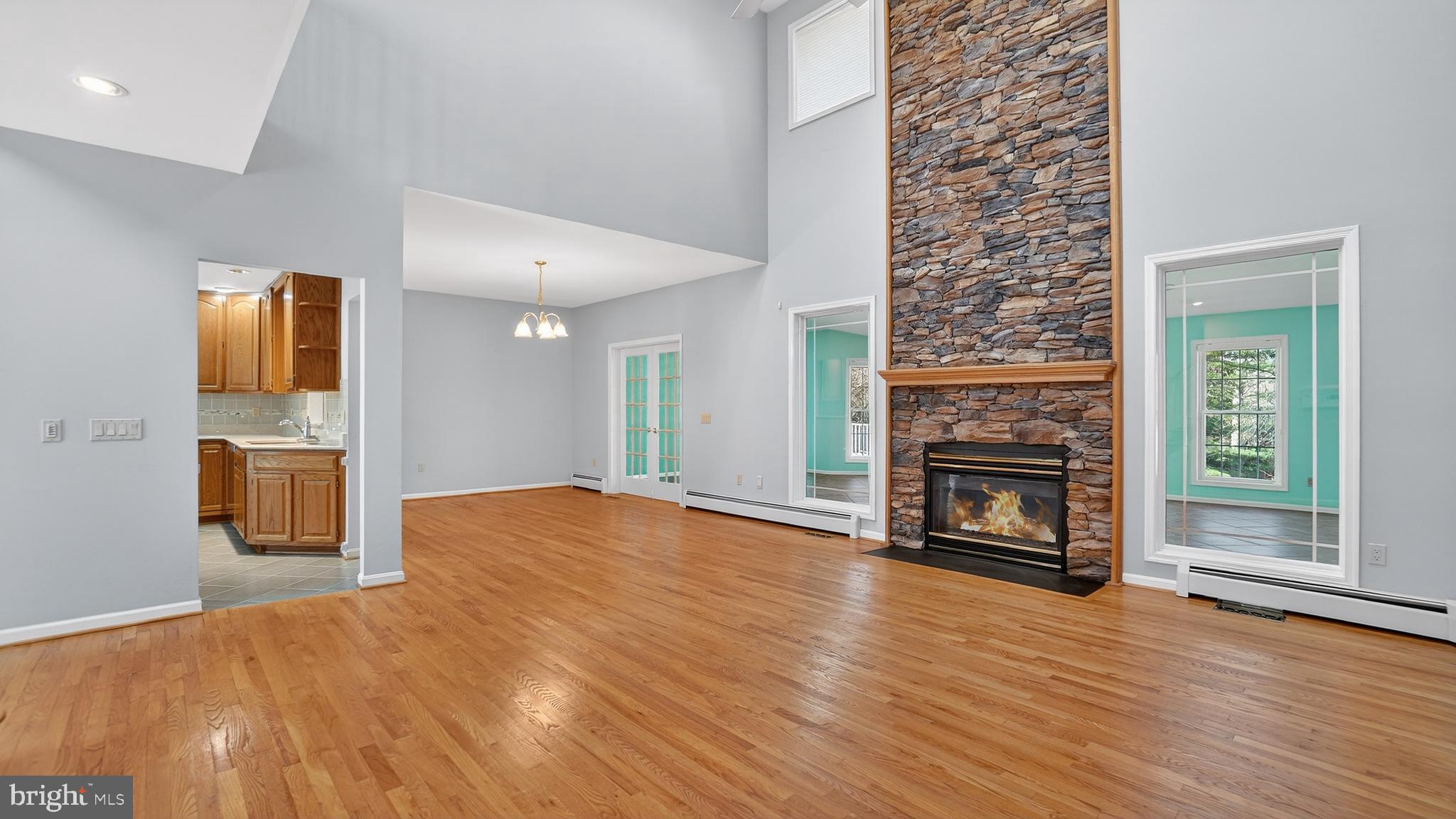 15022 Snowden Drive Silver Spring, MD 20905 - Photo 26 of 88 a view of empty room with wooden floor and fireplace