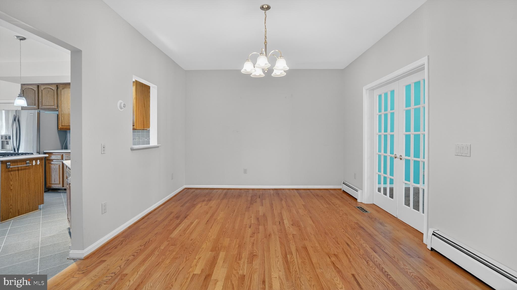 15022 Snowden Drive Silver Spring, MD 20905 - Photo 32 of 88 a view of an empty room with wooden floor and a window