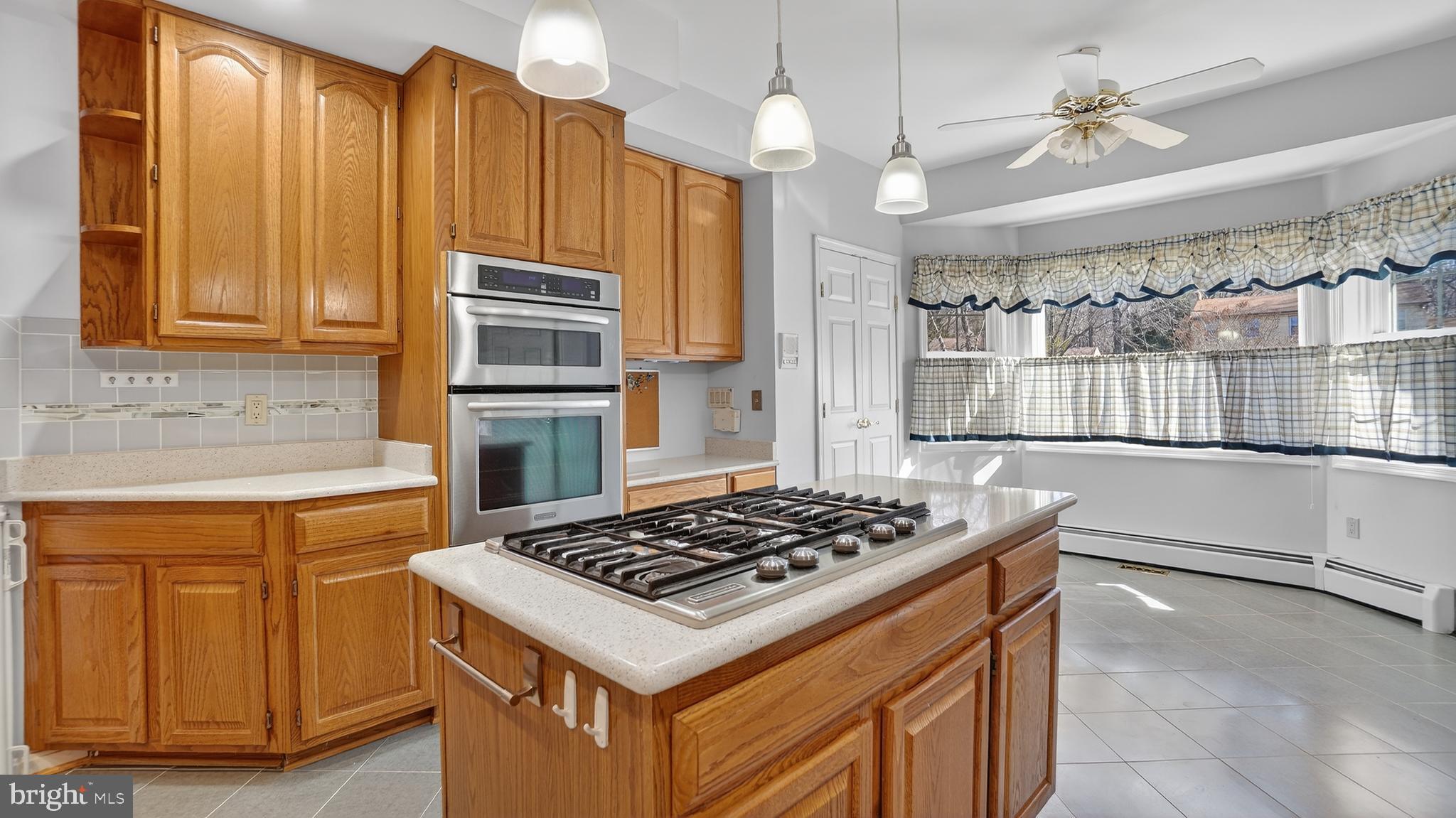 15022 Snowden Drive Silver Spring, MD 20905 - Photo 34 of 88 a kitchen with a stove and a sink