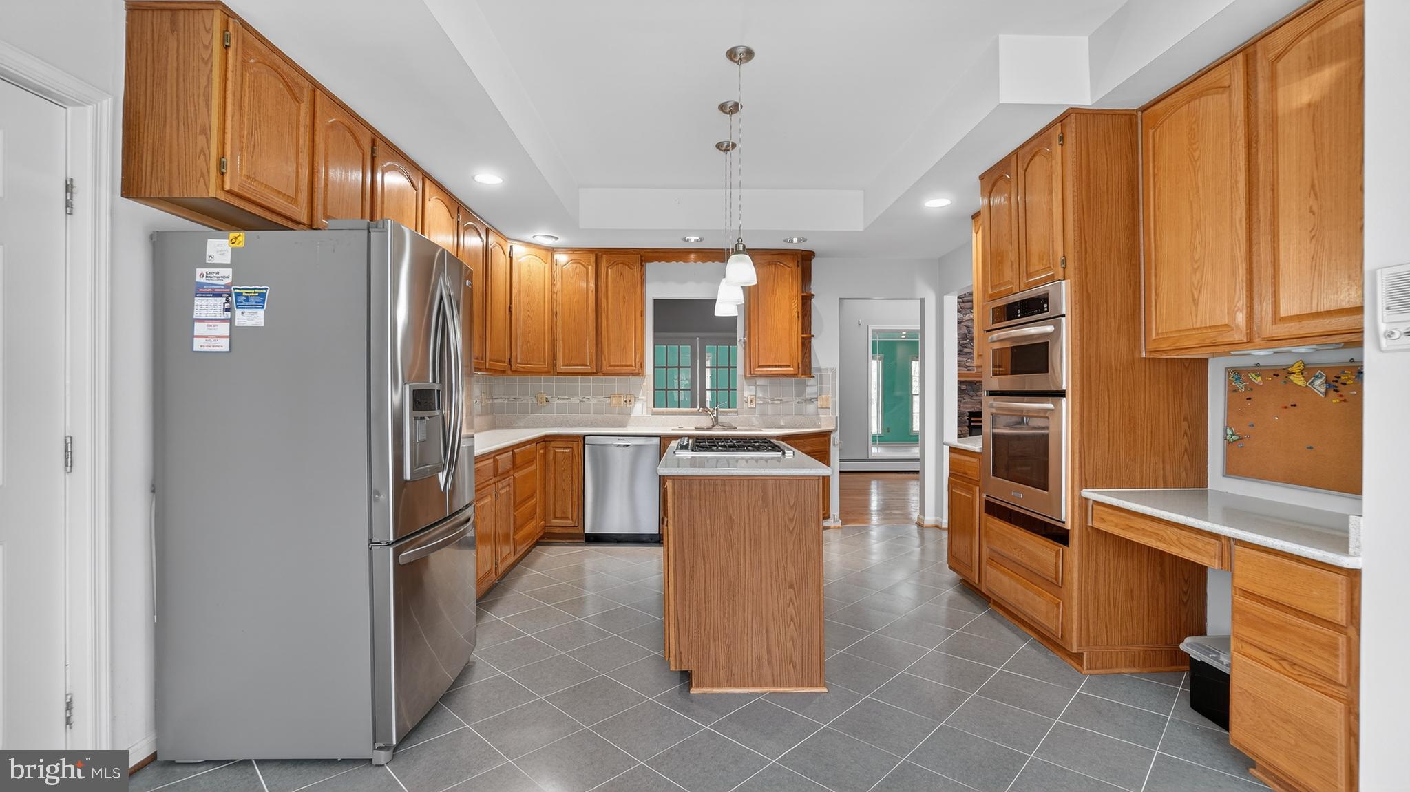 15022 Snowden Drive Silver Spring, MD 20905 - Photo 37 of 88 a kitchen with stainless steel appliances granite countertop a refrigerator a oven and a stove