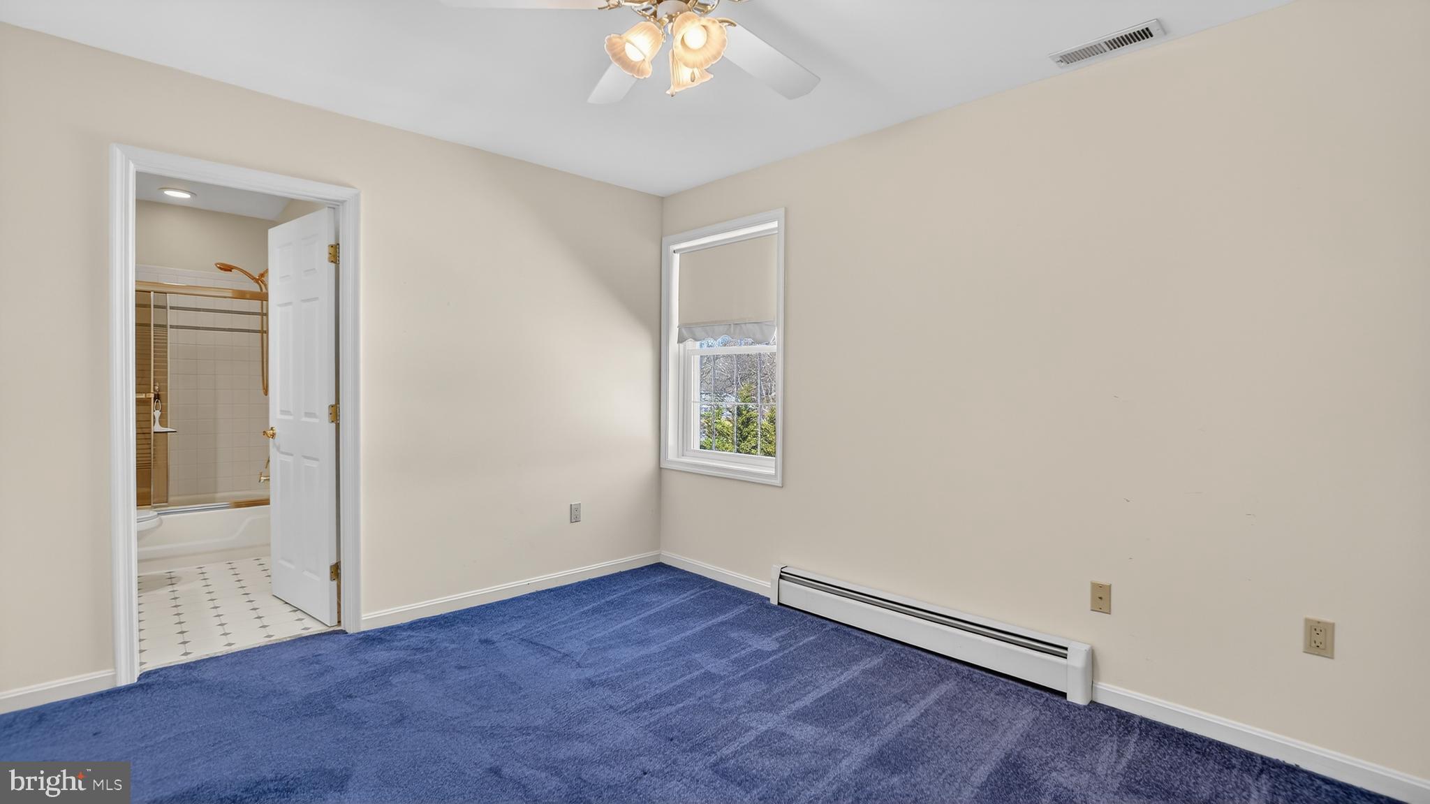 15022 Snowden Drive Silver Spring, MD 20905 - Photo 49 of 88 an empty room with wooden floor and windows