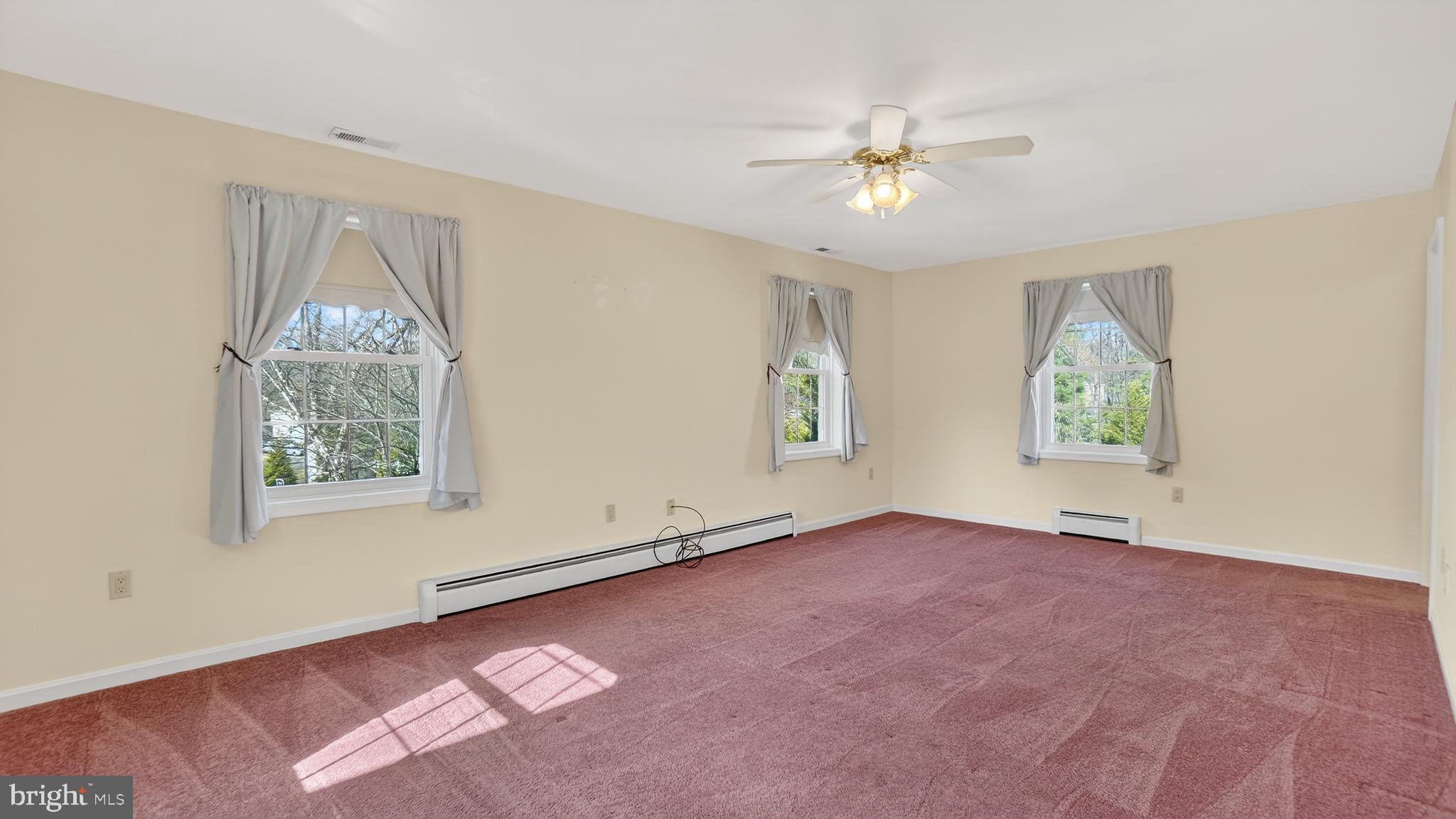 15022 Snowden Drive Silver Spring, MD 20905 - Photo 52 of 88 an empty room with windows and fan