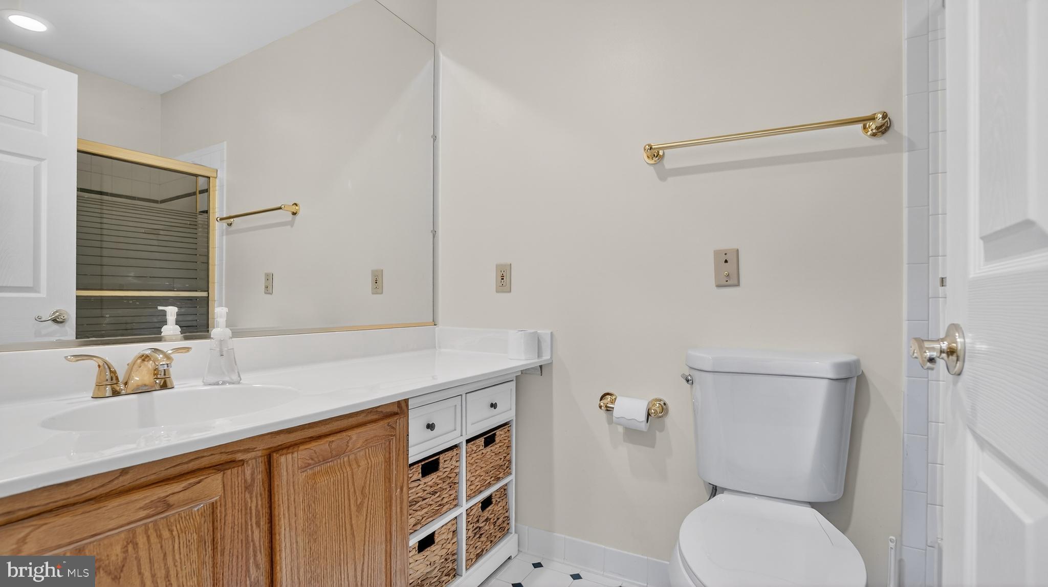 15022 Snowden Drive Silver Spring, MD 20905 - Photo 57 of 88 a bathroom with a sink a toilet and shower