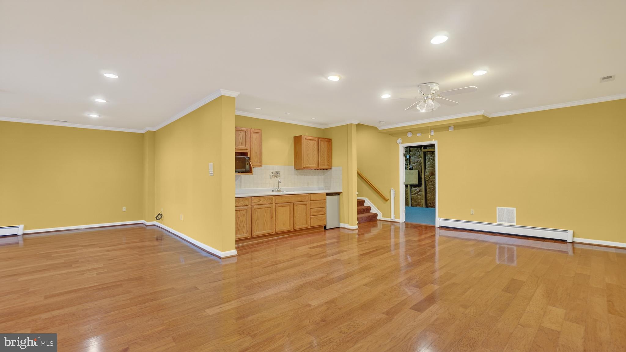 15022 Snowden Drive Silver Spring, MD 20905 - Photo 61 of 88 a view of an empty room with wooden floor