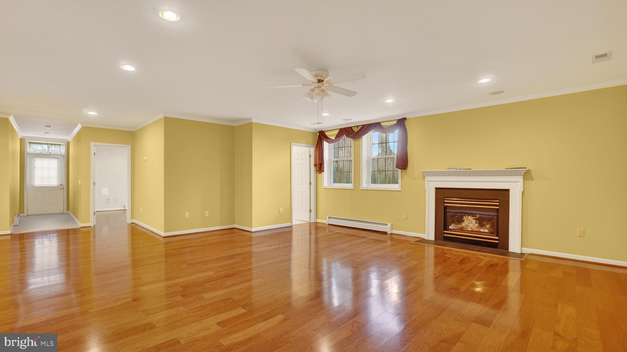 15022 Snowden Drive Silver Spring, MD 20905 - Photo 66 of 88 a view of an empty room with window and wooden floor