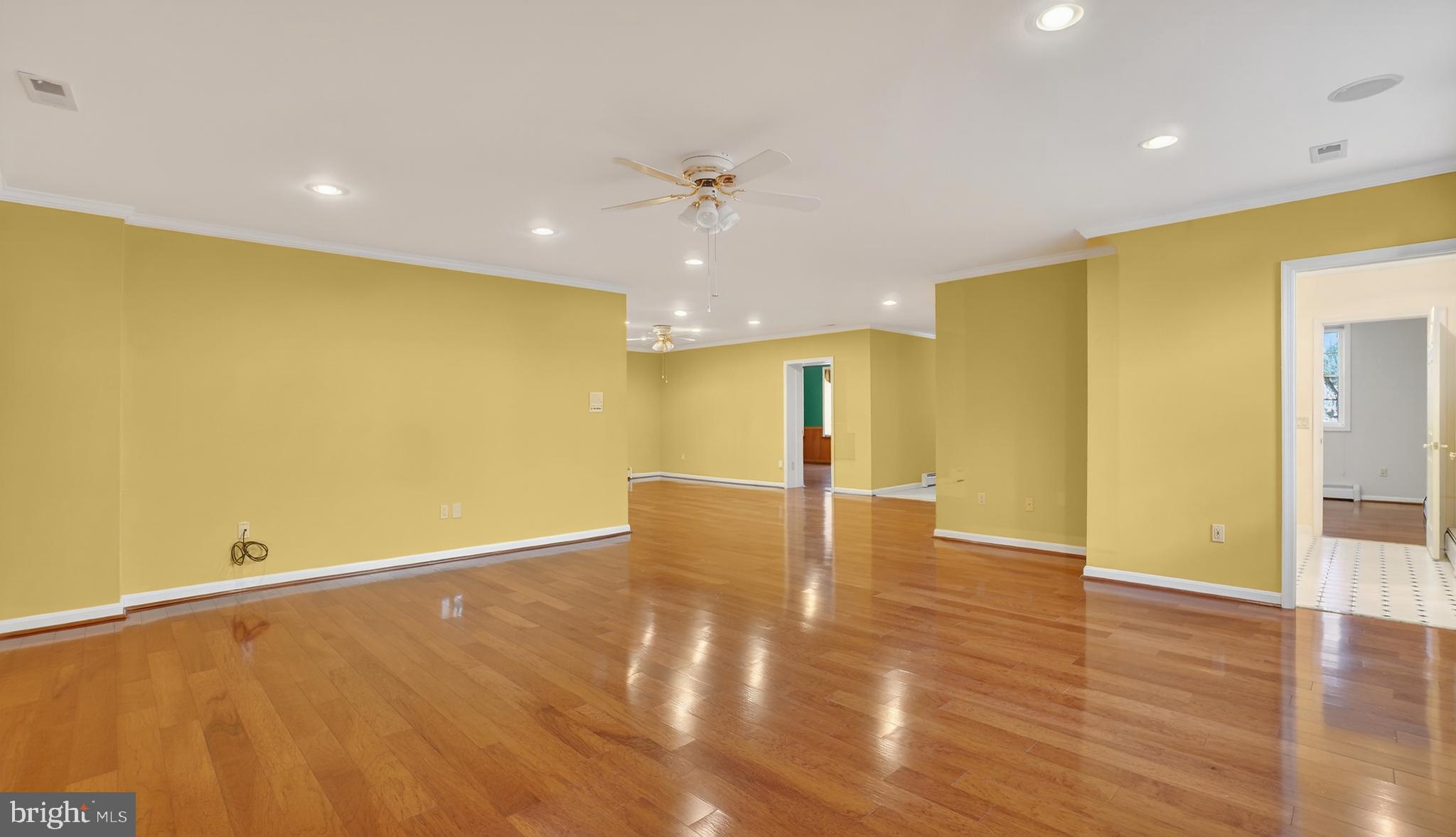 15022 Snowden Drive Silver Spring, MD 20905 - Photo 67 of 88 a view of an empty room with wooden floor