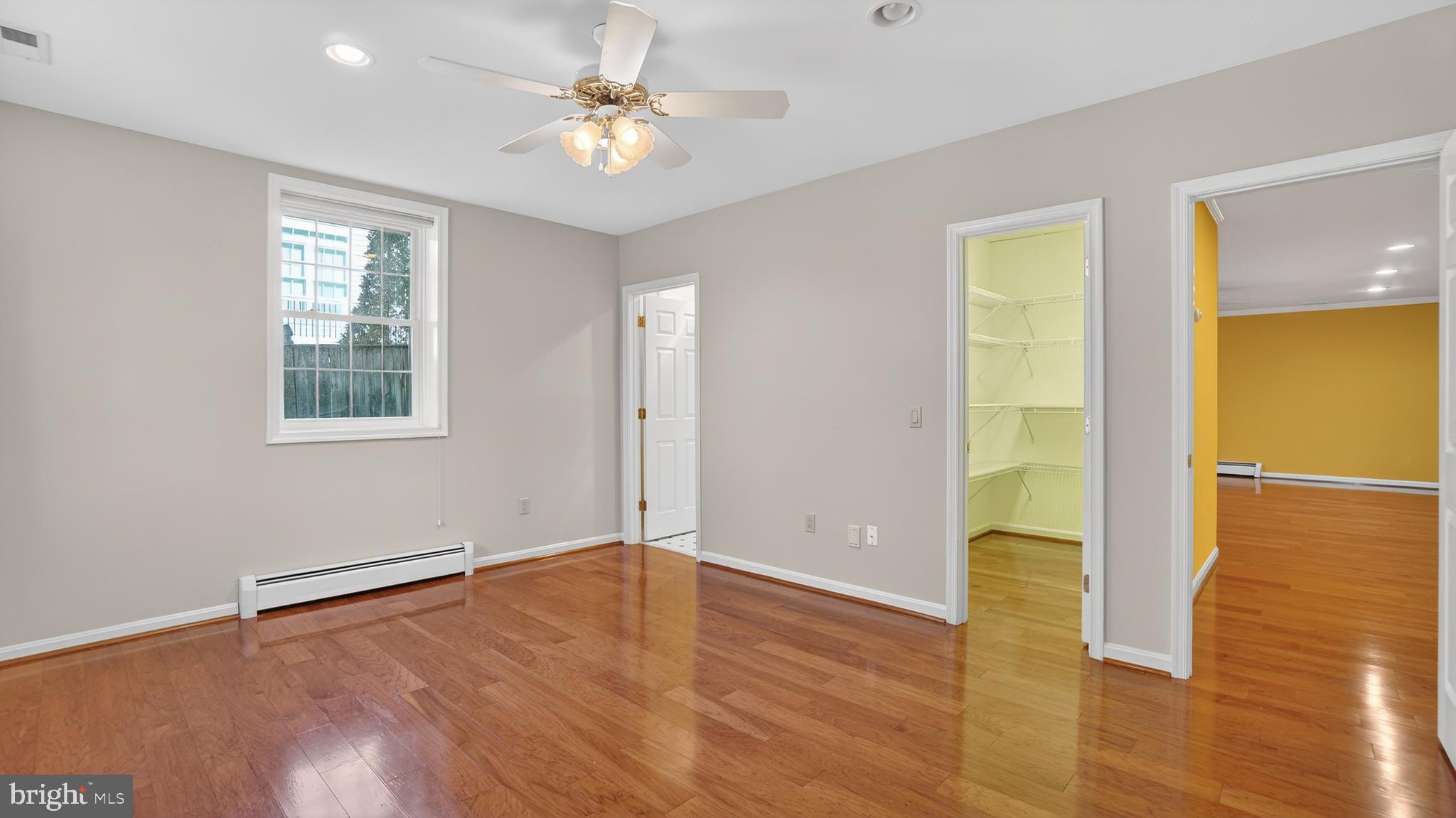 15022 Snowden Drive Silver Spring, MD 20905 - Photo 69 of 88 an empty room with wooden floor and windows