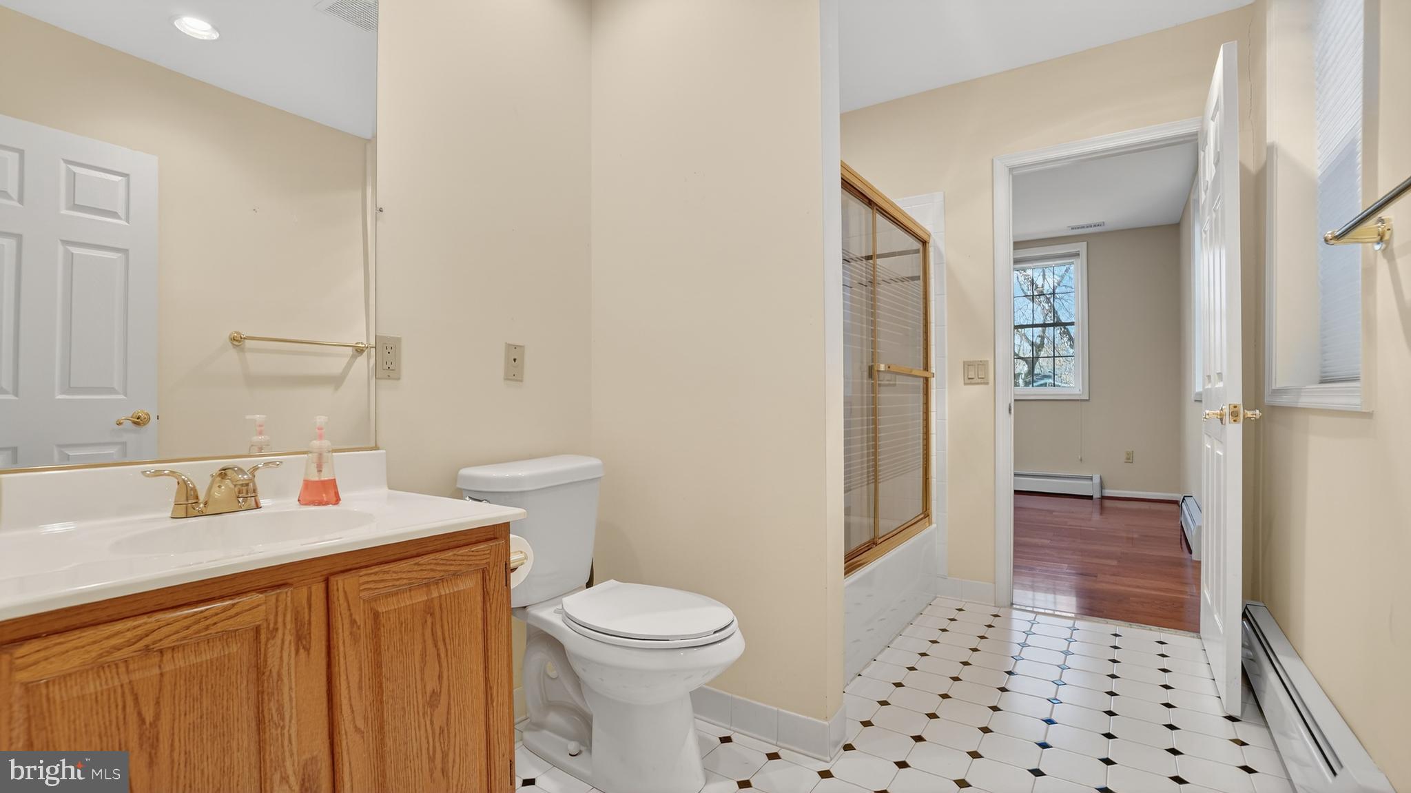 15022 Snowden Drive Silver Spring, MD 20905 - Photo 71 of 88 a bathroom with a sink a toilet and shower