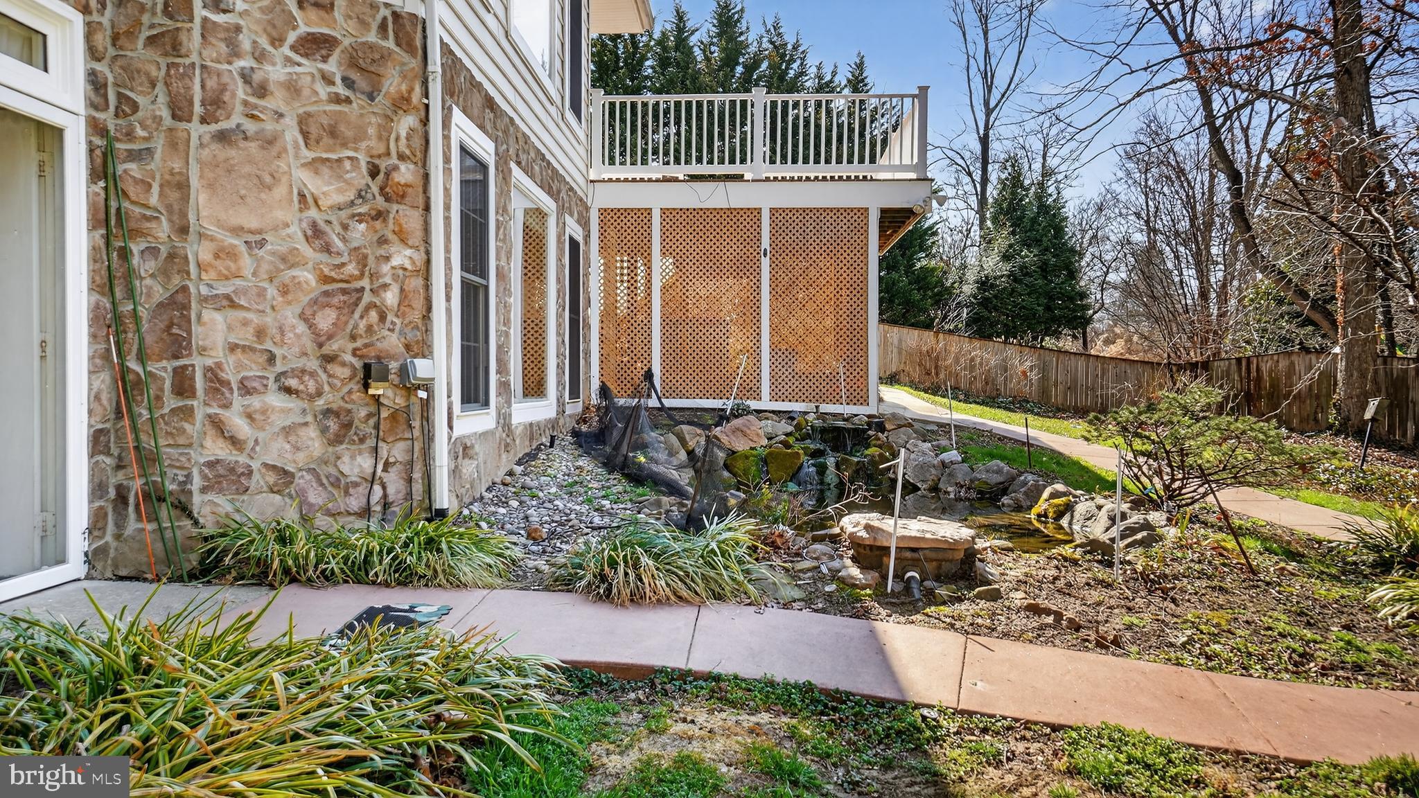 15022 Snowden Drive Silver Spring, MD 20905 - Photo 78 of 88 a front view of a house with a yard and potted plants