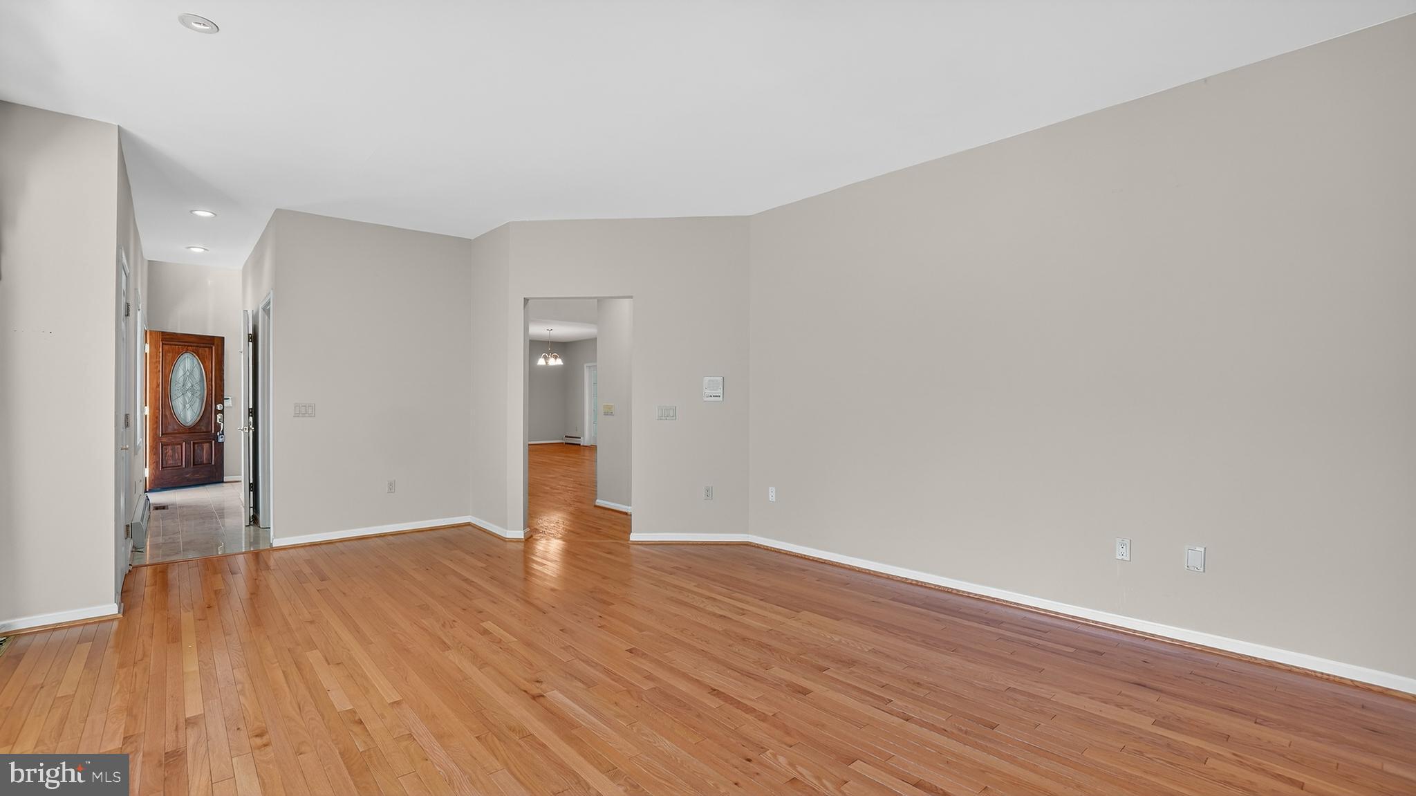15022 Snowden Drive Silver Spring, MD 20905 - Photo 8 of 88 a view of an empty room and wooden floor