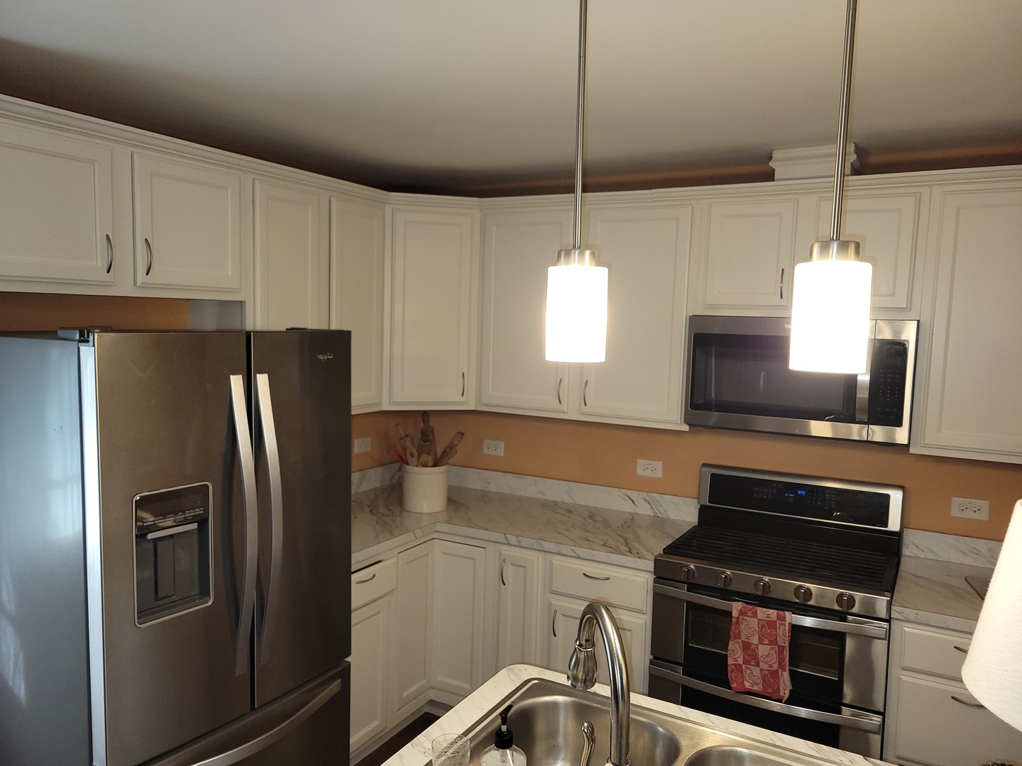 1321 Burr Oak Road Homewood, IL 60430 - Photo 3 of 15 a kitchen with stainless steel appliances a stove a refrigerator and a sink