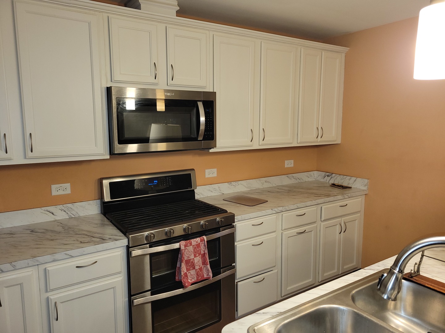 1321 Burr Oak Road Homewood, IL 60430 - Photo 4 of 15 a kitchen with granite countertop a sink cabinets and stainless steel appliances