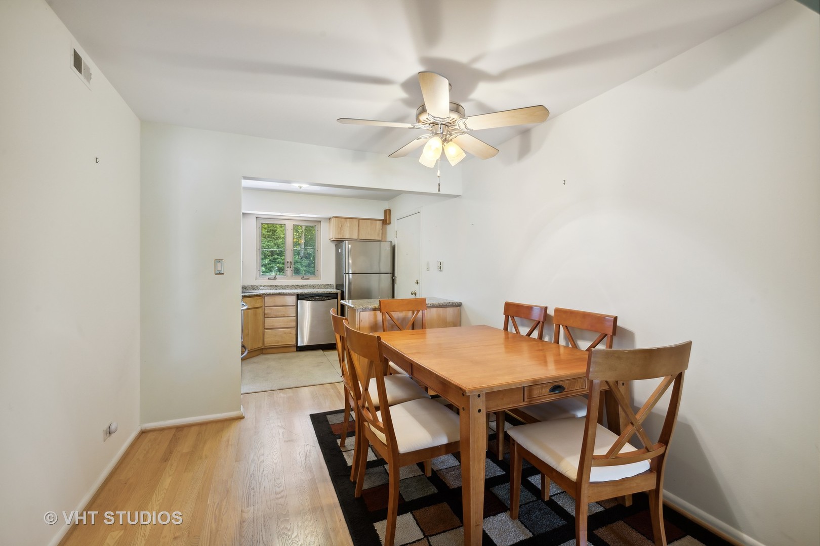 67 Kimbark Road, Unit 3 Riverside, IL 60546 - Photo 3 of 10 a view of a dining room with furniture and a chandelier fan