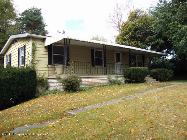 1 Rr Falls Falls, PA 18615 - Photo 1 of 7 a front view of a house with garden