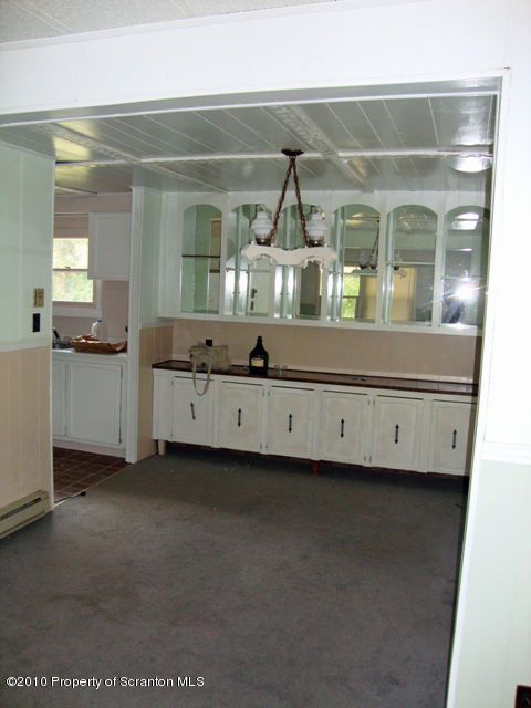 1 Rr Falls Falls, PA 18615 - Photo 3 of 7 a bathroom with a double vanity sink and mirror