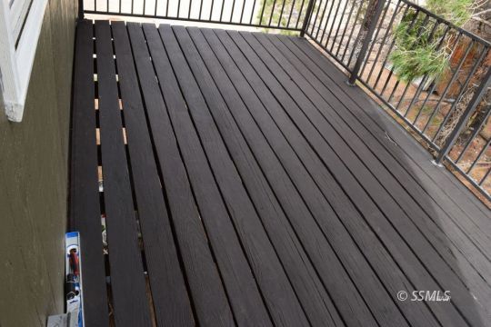 1130 South Guam Street Ridgecrest, CA 93555 - Photo 12 of 12 a balcony with wooden floor