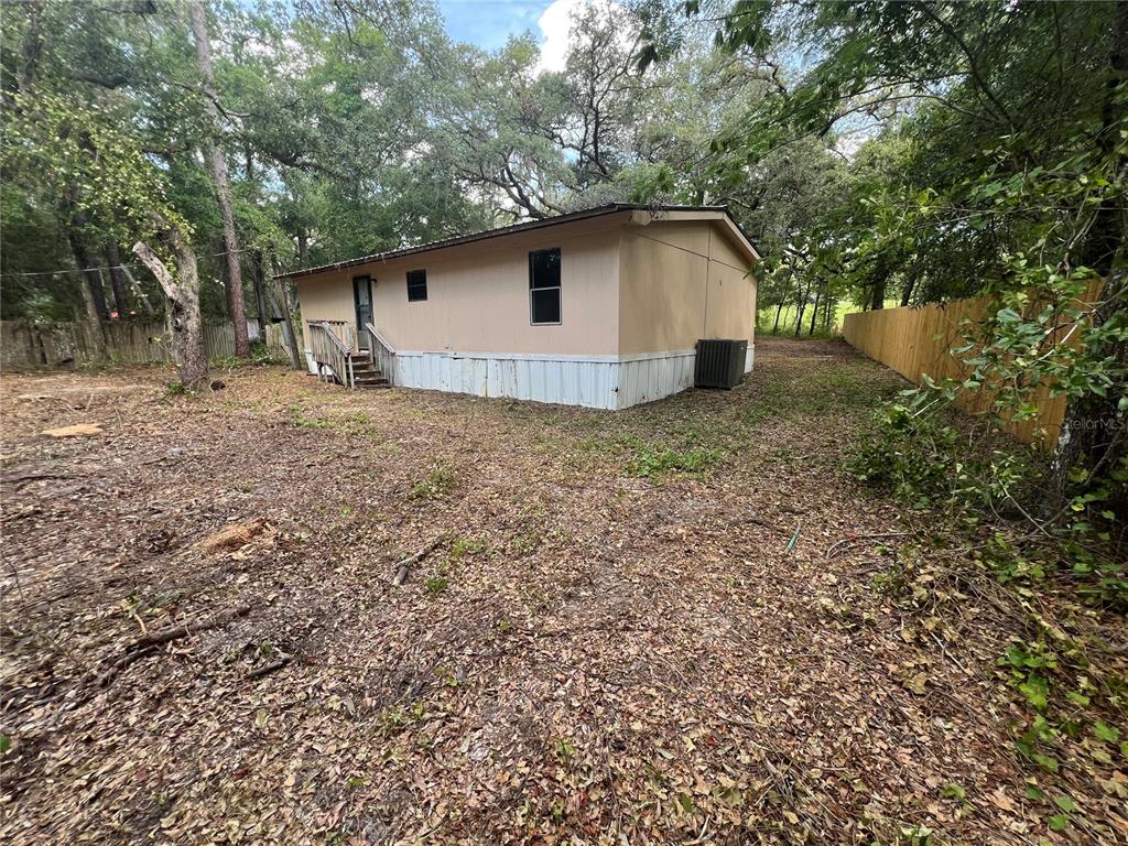 1963 Highway 20 Hawthorne, FL 32640 - Photo 9 of 12 a house with trees in the background