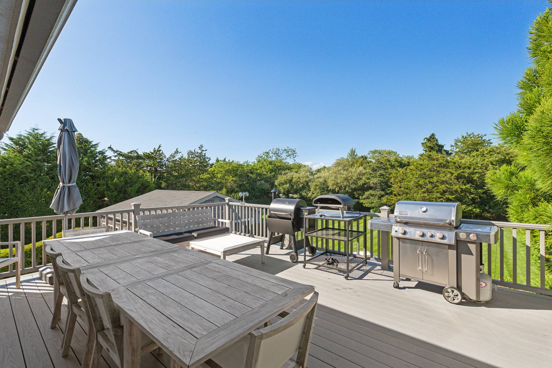 4 Bayberry Lane Remsenburg, NY 11960 - Photo 19 of 29 a view of a deck with furniture and trees