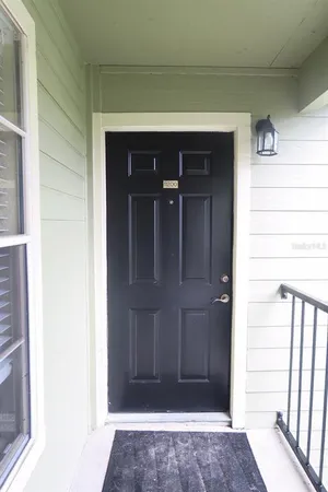 a view of entryway with a wooden door