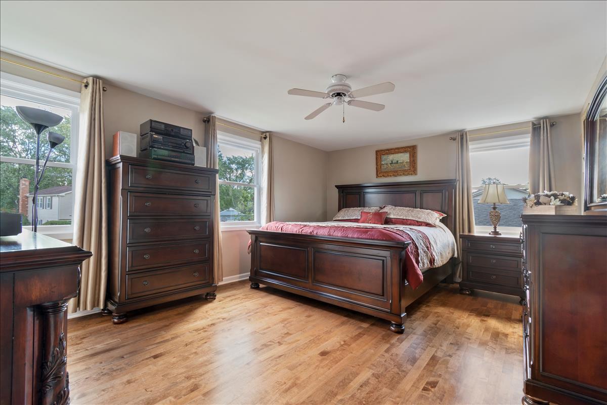 110 Stonegate Road Buffalo Grove, IL 60089 - Photo 14 of 25 a bedroom with a bed and a closet