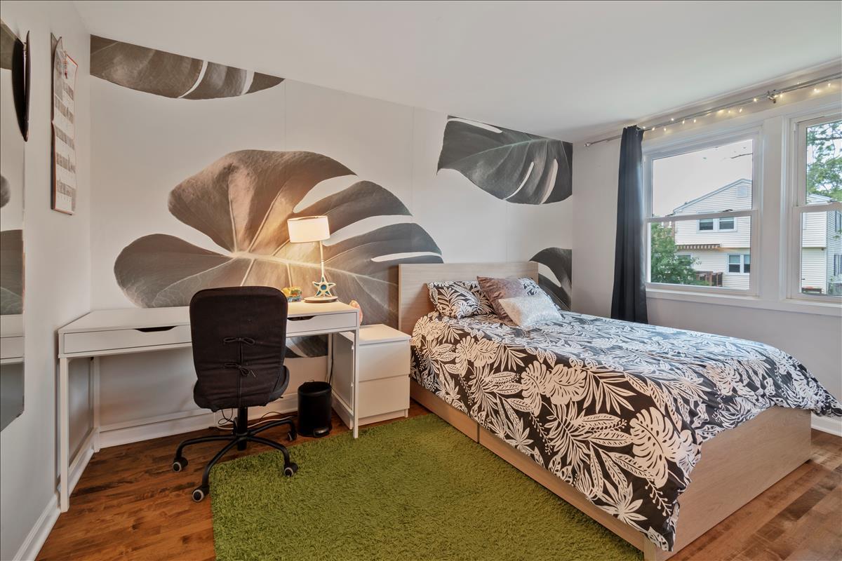 110 Stonegate Road Buffalo Grove, IL 60089 - Photo 18 of 25 a bedroom with a bed chair and window