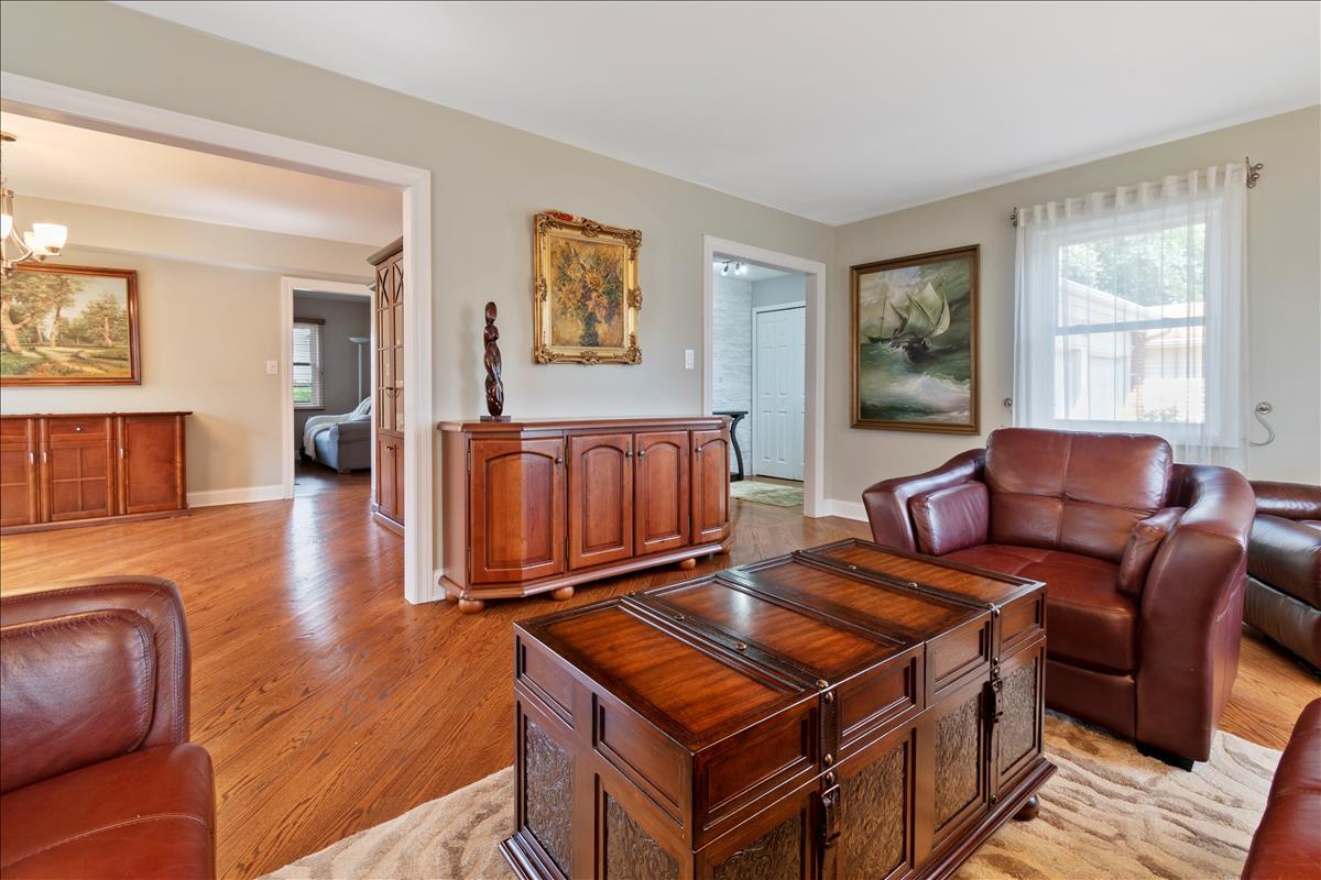 110 Stonegate Road Buffalo Grove, IL 60089 - Photo 5 of 25 a living room with furniture a wooden floor and a window