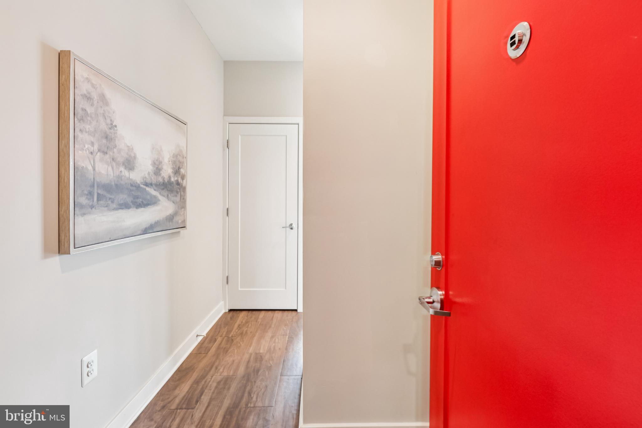 989 South Buchanan Street, Unit 225 Arlington, VA 22204 - Photo 29 of 42 a view of a hallway with wooden floor