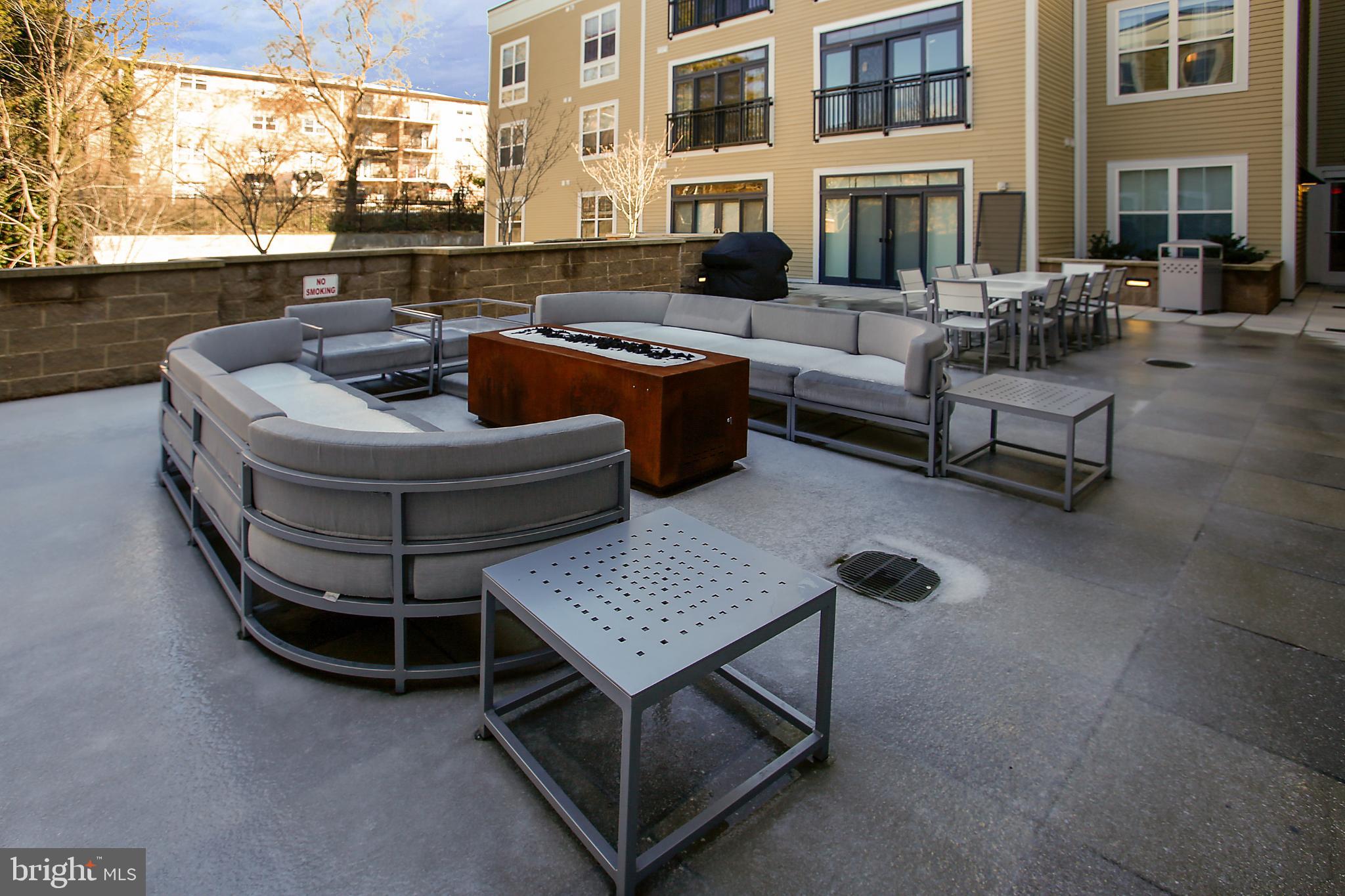 989 South Buchanan Street, Unit 225 Arlington, VA 22204 - Photo 38 of 42 a view of an outdoor sitting area with brick walls