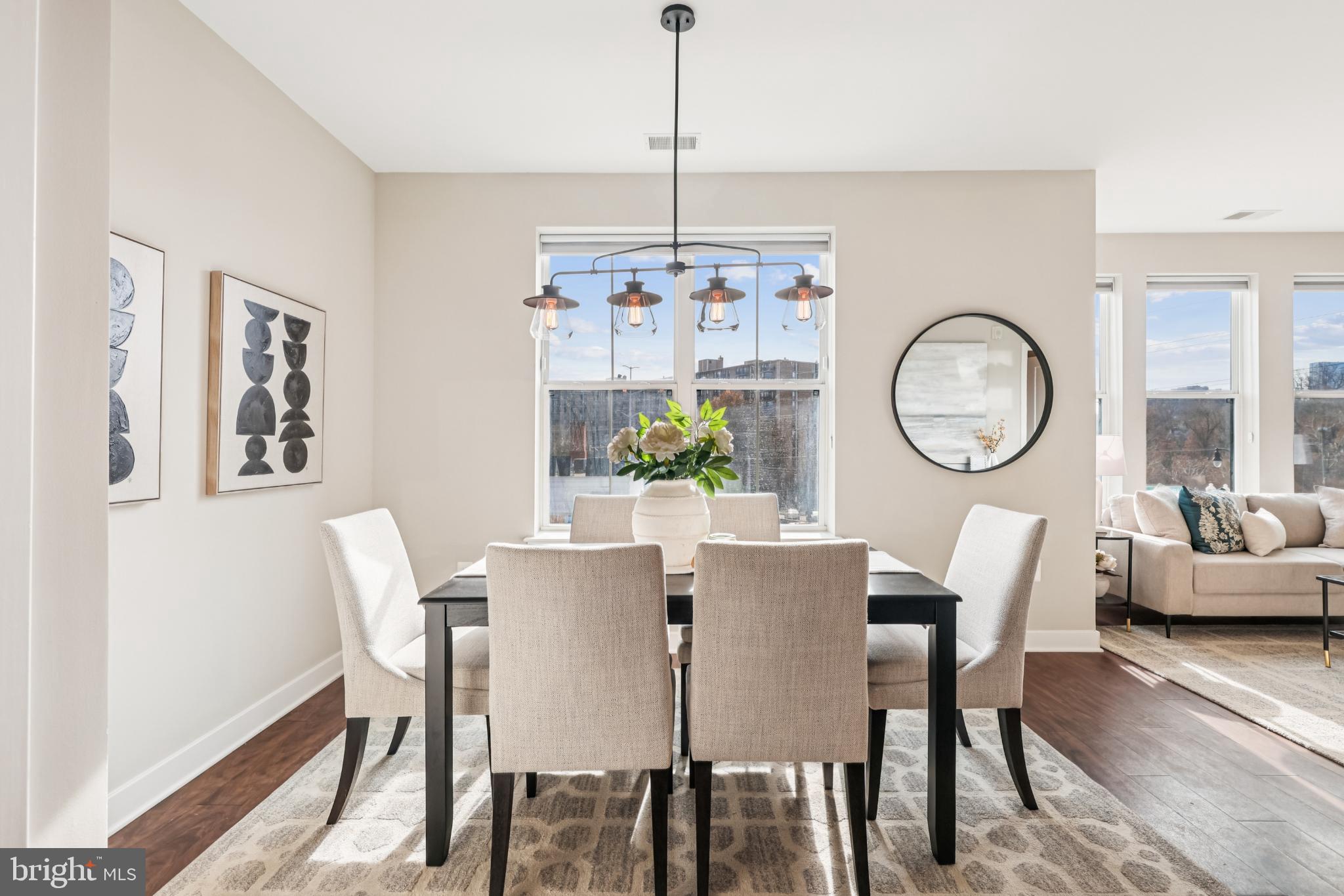 989 South Buchanan Street, Unit 225 Arlington, VA 22204 - Photo 5 of 42 a view of a dining room with furniture window and wooden floor
