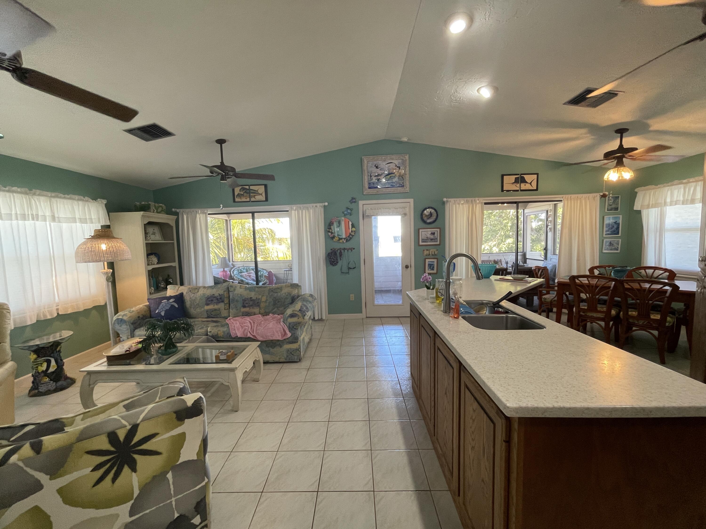 22979 Sharp Lane Cudjoe, FL 33042 - Photo 13 of 18 a kitchen with a sink and white cabinets