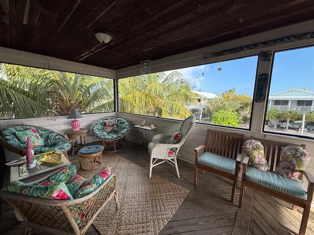 22979 Sharp Lane Cudjoe, FL 33042 - Photo 9 of 18 a outdoor living space with furniture and garden view