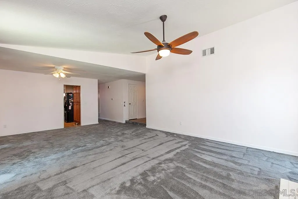 10941 Del Rio Road Spring Valley, CA 91978 - Photo 4 of 19 an empty room with closet and a ceiling fan
