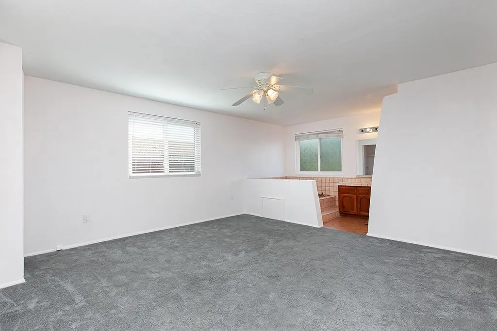 10941 Del Rio Road Spring Valley, CA 91978 - Photo 9 of 19 wooden floor in an empty room with a window