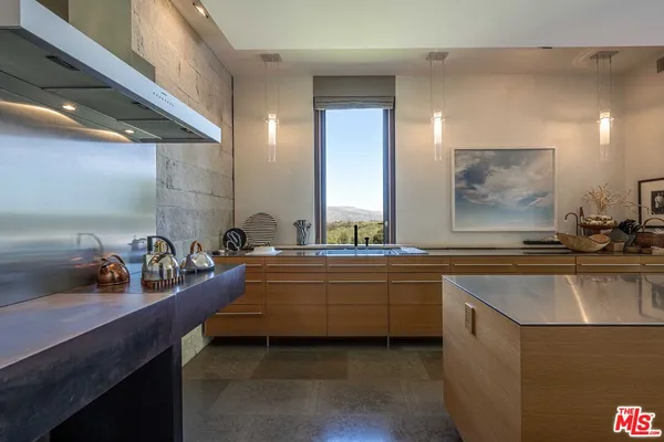 a dining room with furniture window and wooden floor