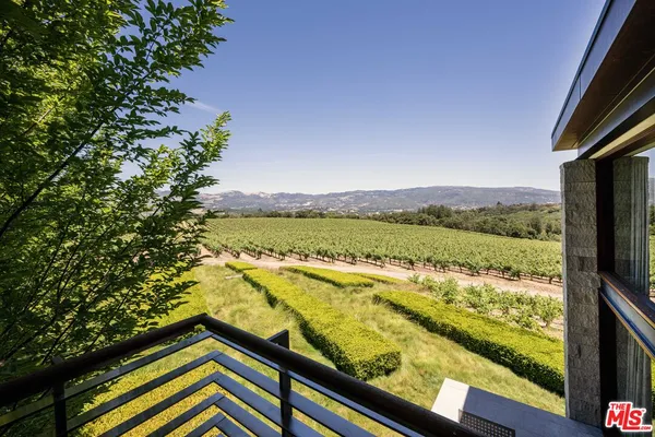 a view of a chairs and tables on the roof deck