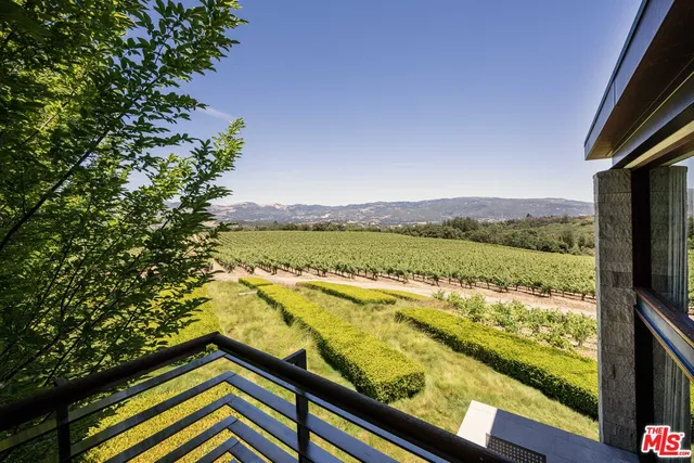 a view of a chairs and tables on the roof deck